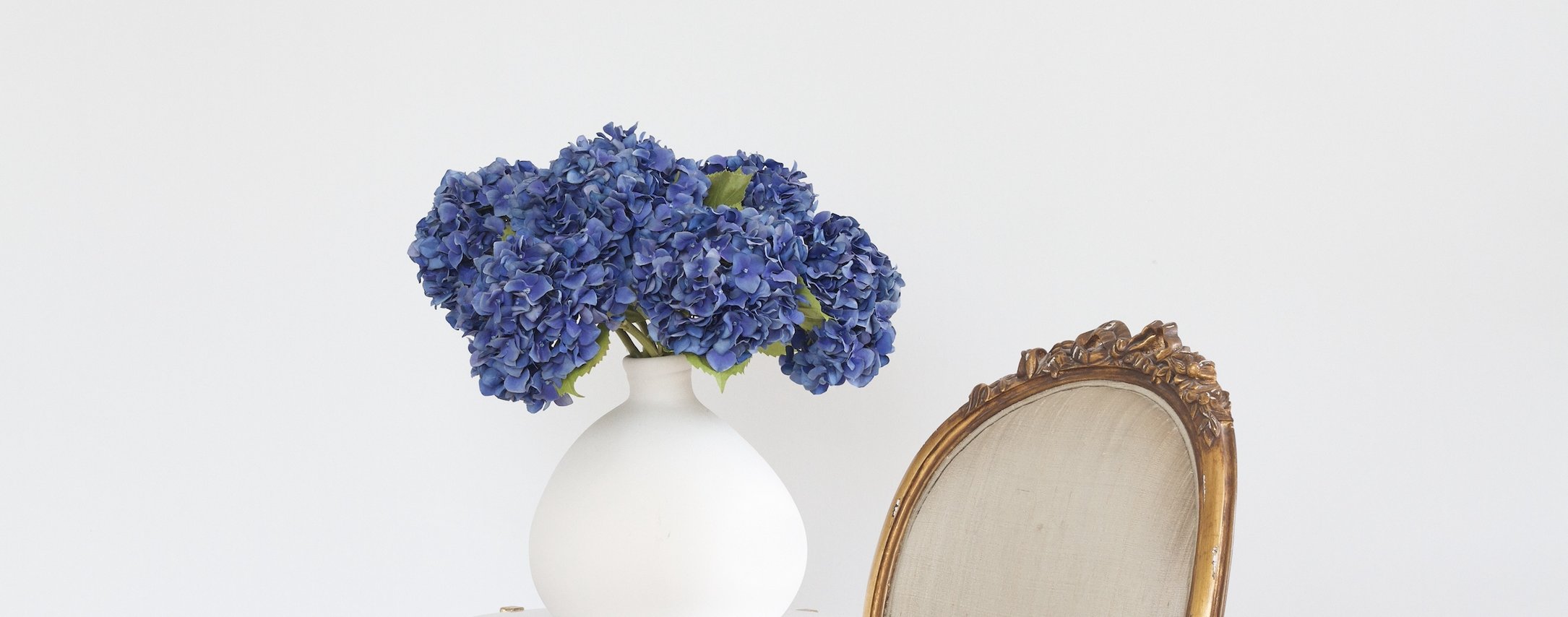realistic blue artificial flowers don't look fake! Perfect blue faux flowers including navy blue silk flowers, artificial blue hydrangeas & artificial blue flowers in vase.