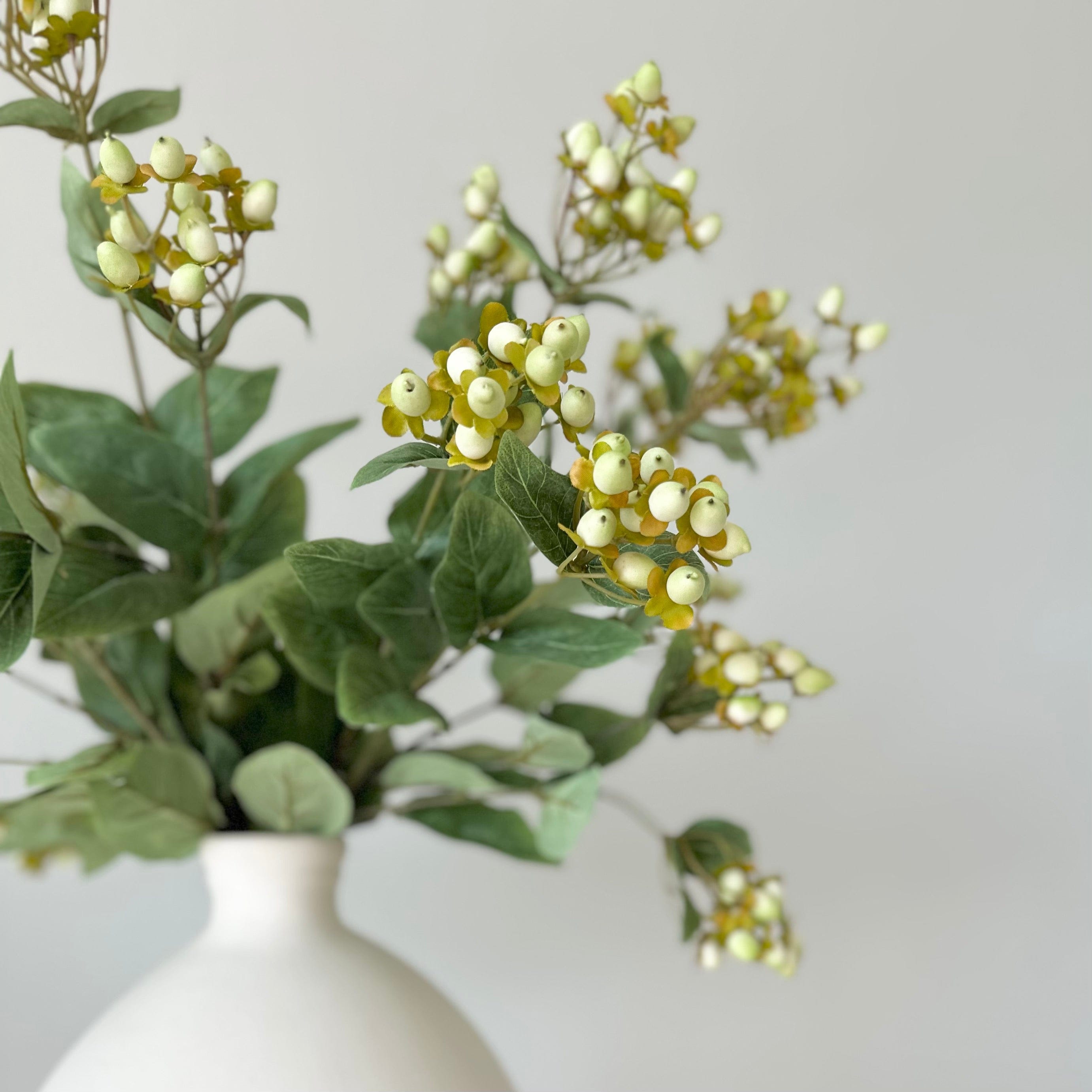Artificial flowers luxury lifelike faux Artificial Green Hypericum Berries realistic silk single stems buy online from The Faux Flower Company