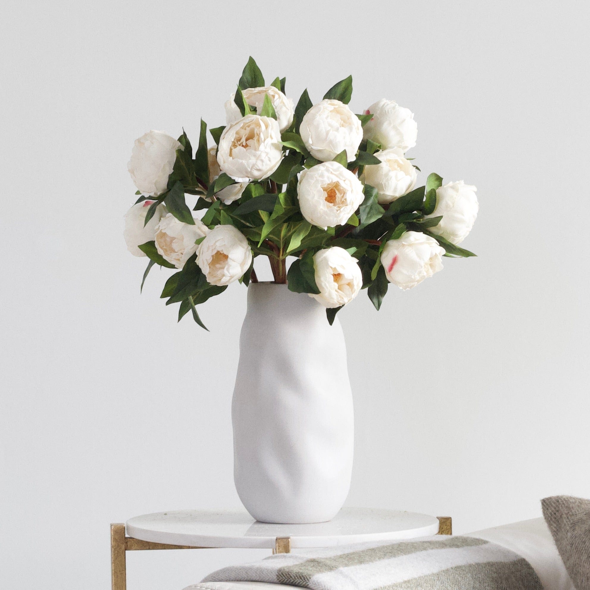Luxury Lifelike Realistic Artificial Fabric Silk Blooms with Foliage Buy Online from The Faux Flower Company | 7 stems of White Real Touch Peony ABZ9148WH styled in Naunton Vase ABP525B