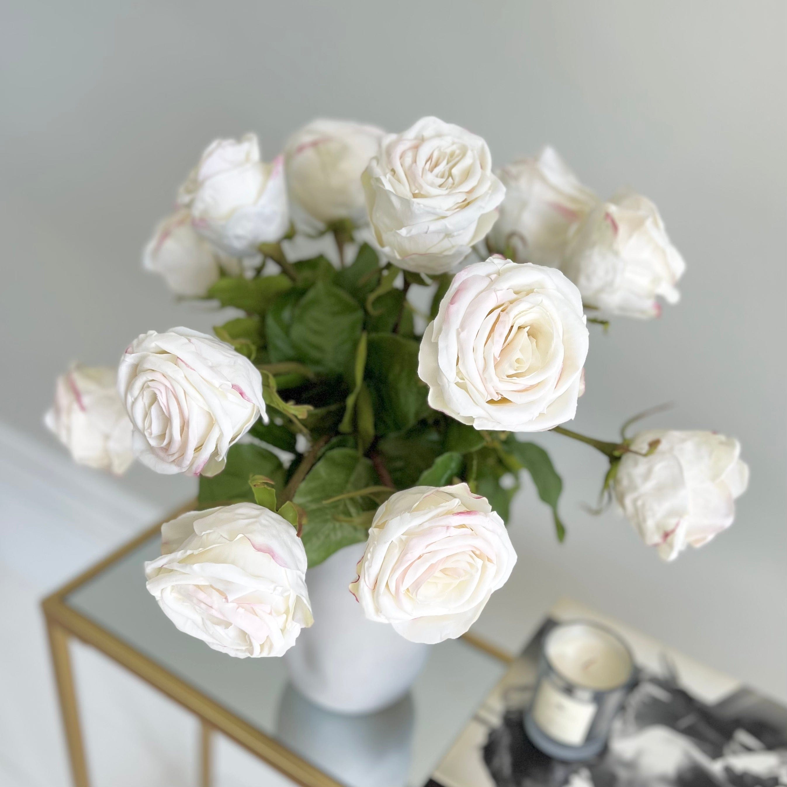 White silk shop roses