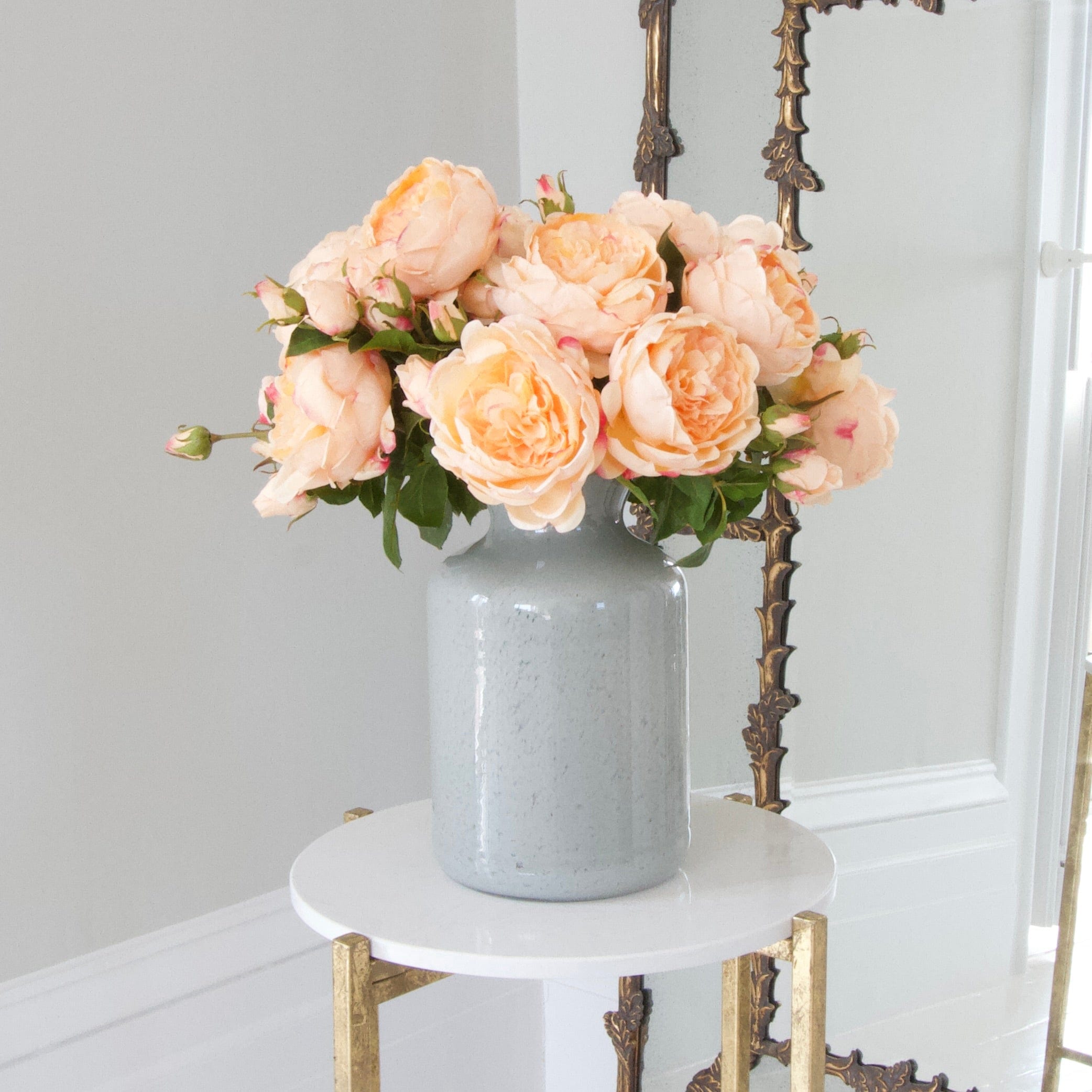 Luxury Lifelike Realistic Artificial Fabric Silk Blooms with Foliage Buy Online from The Faux Flower Company | 12 stems Peach English Rose ABY5013PC styled in Grey Glass Funnel Neck Vase ABV0144