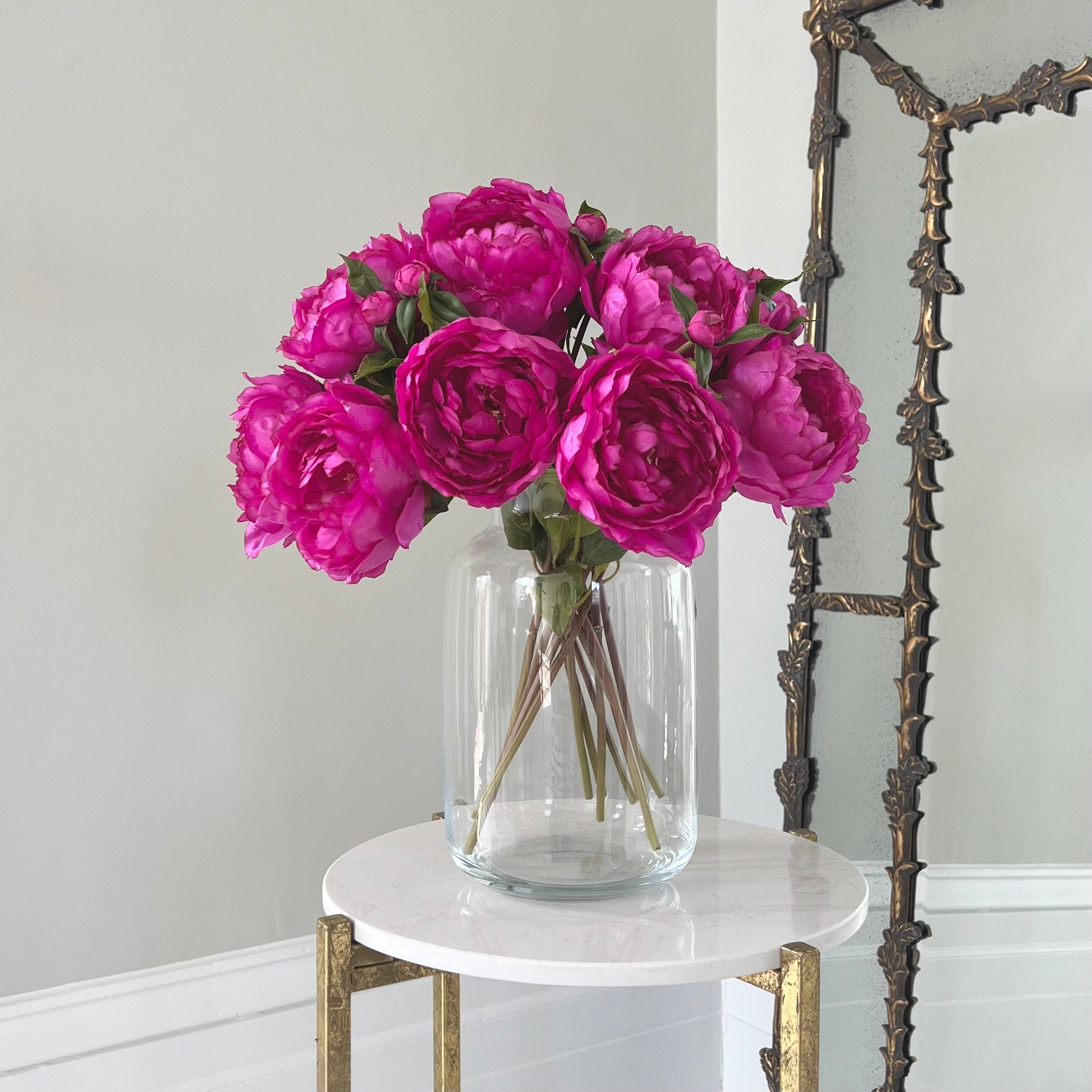 Luxury Lifelike Realistic Artificial Fabric Silk Blooms with Foliage Buy Online from The Faux Flower Company | 12 stems of Fuchsia Classic Peony ABY6043FU styled in Clear Glass Large Funnel Neck Vase ABV2253