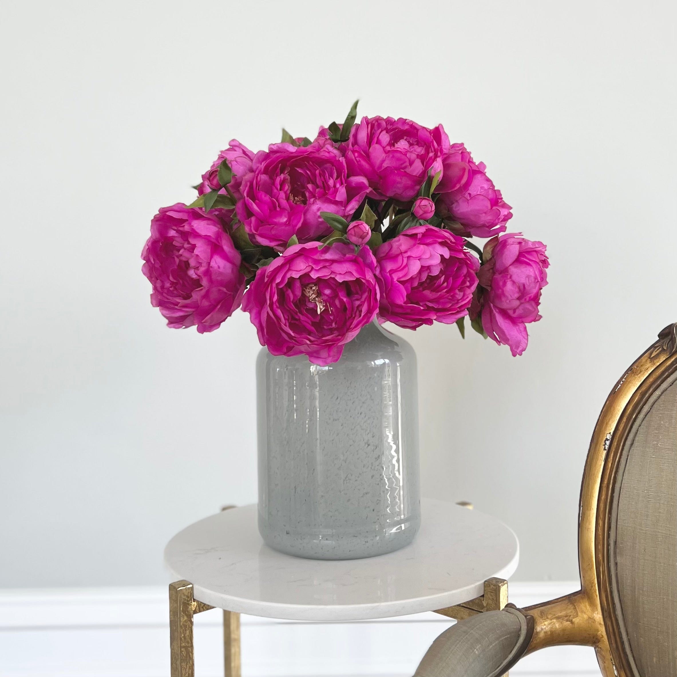 Luxury Lifelike Realistic Artificial Fabric Silk Blooms with Foliage Buy Online from The Faux Flower Company | 12 stems of Fuchsia Classic Peony ABY6043FU styled in Grey Glass Large Funnel Neck Vase ABV0144