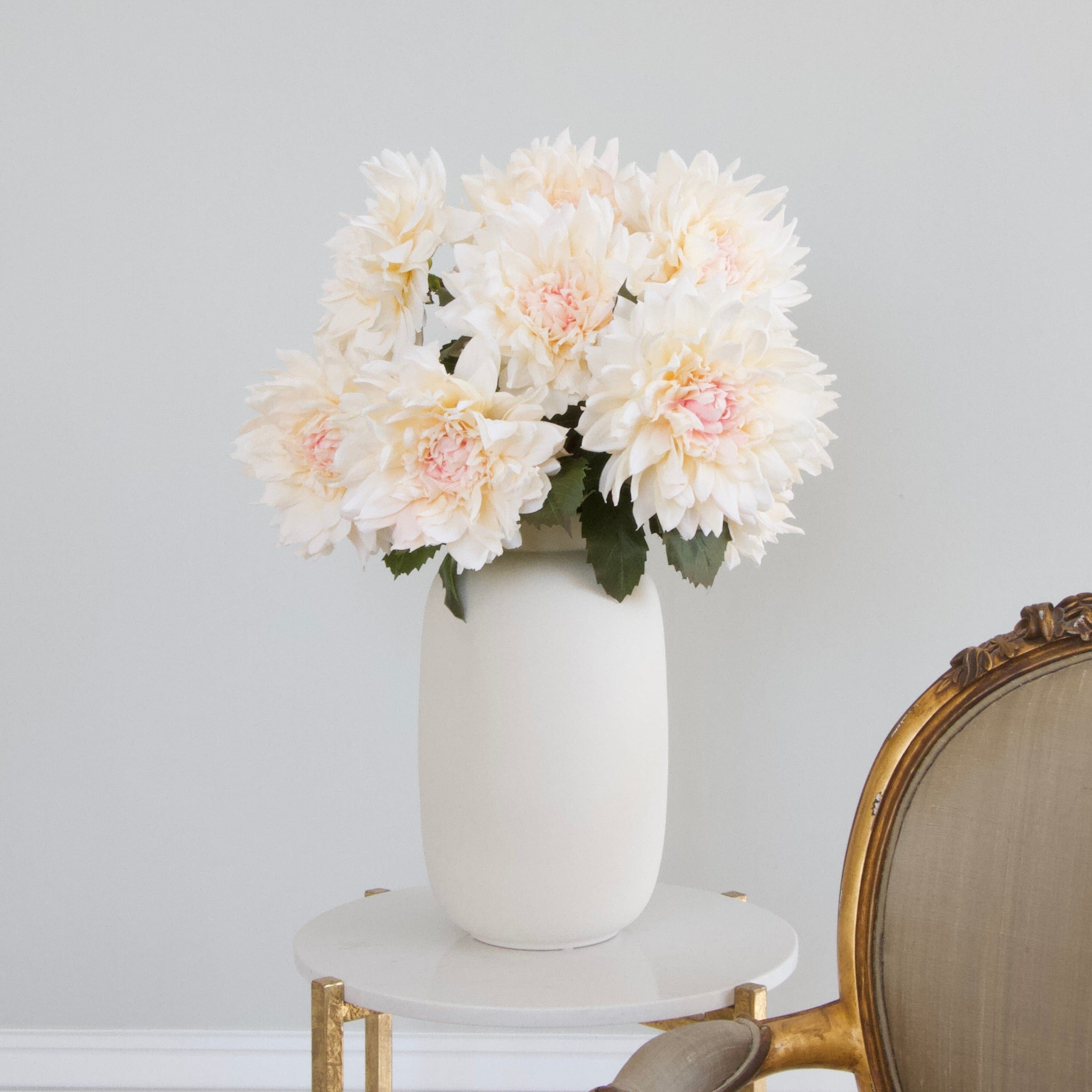 Luxury Lifelike Realistic Artificial Fabric Silk Blooms with Foliage Buy Online from The Faux Flower Company | 12 stems of Pale Pink Cafe Au Lait Dahlia ABY2216 styled in Ceramic Matte White Kingham Vase ABP04B3