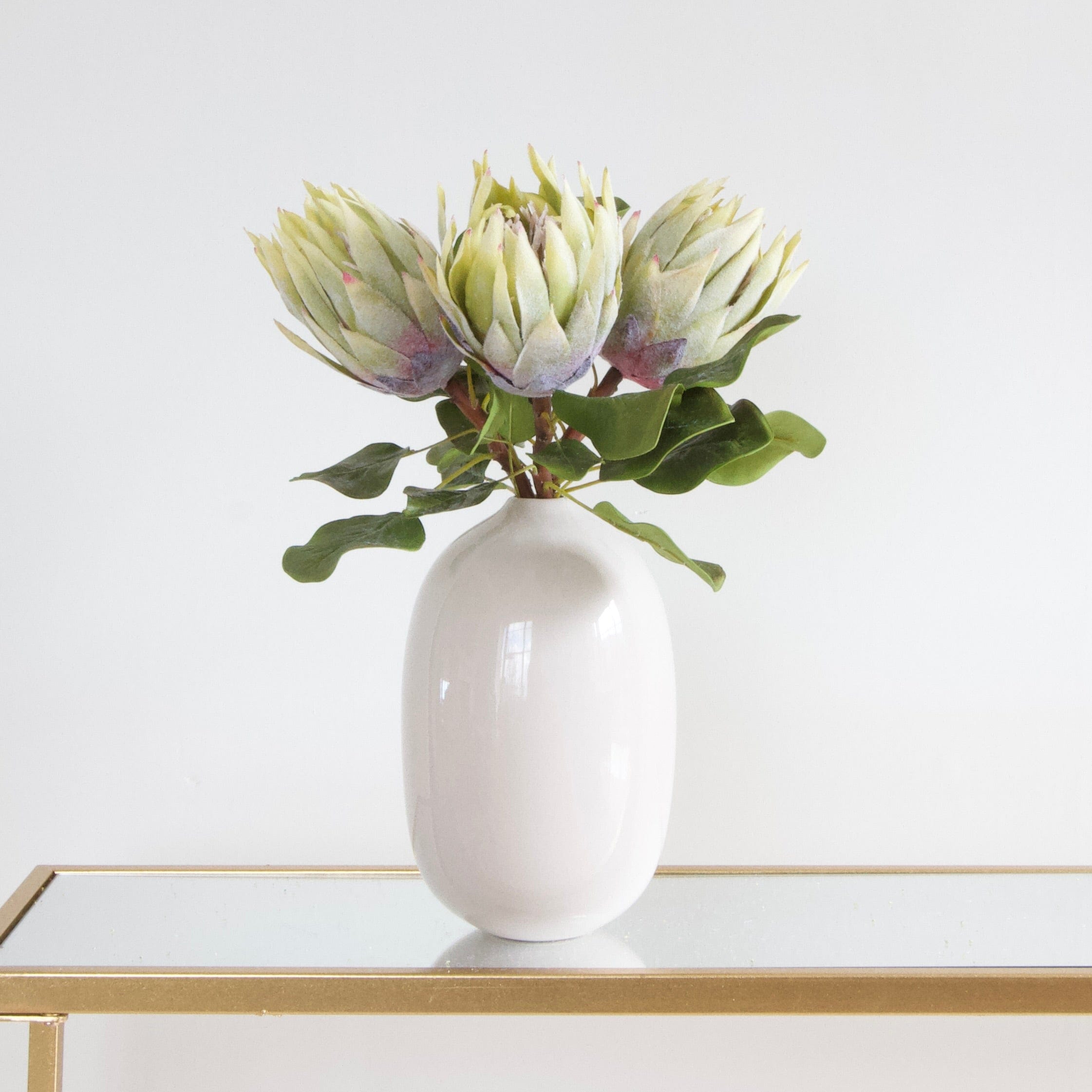Luxury Lifelike Realistic Artificial Fabric Silk Blooms with Foliage Buy Online from The Faux Flower Company | Green King Proteas ABY7018GR White Gloss Ceramic Broadway Vase ABP1699
