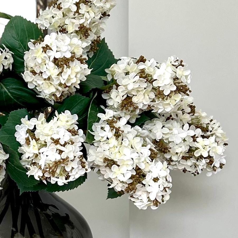 Luxury Lifelike Realistic Artificial Fabric Silk Luxury Flower White Paniculata Hydrangea ABX5004WH Autumn Stem with Foliage in Smoky Grey Bulb Vase ABV0203 Buy Online from The Faux Flower Company_9641