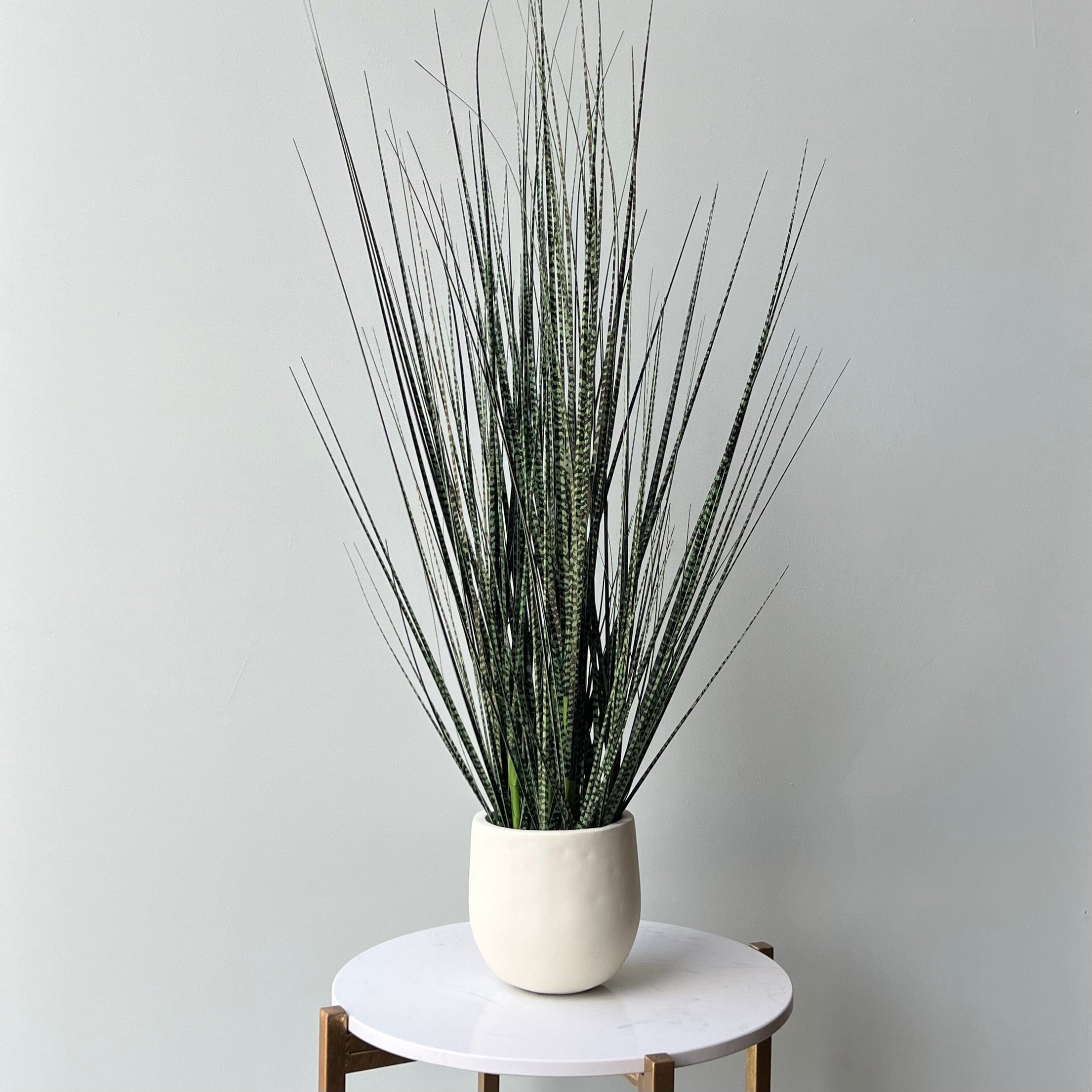 Artificial flowers luxury lifelike faux Artificial Mottled Onion Grass in Stone-look Planter realistic silk  Plants buy online from The Faux Flower Company AHCH-1523