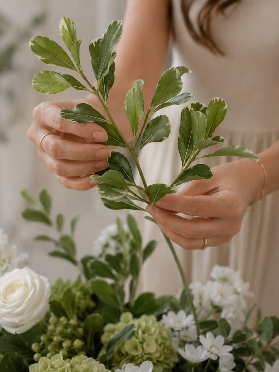Fanning out the leaves and side shoots of faux foliage
