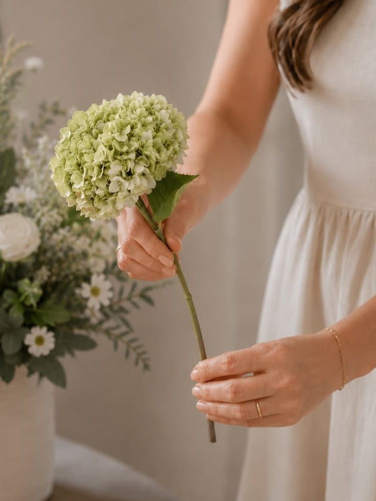 Gently curving a faux hydrangea stem