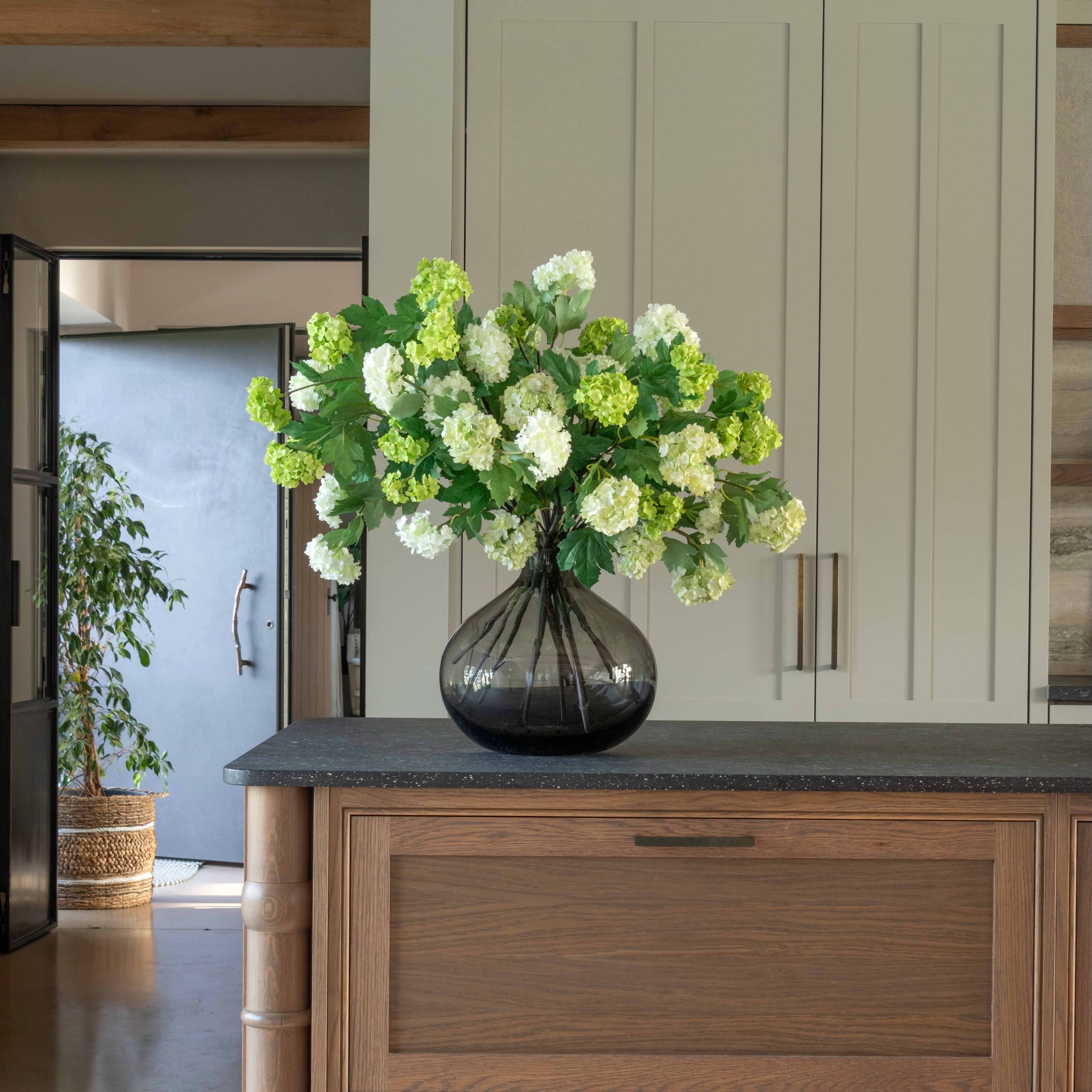 Realistic Spring Greens Artificial Flower Arrangement by The Faux Flower Company