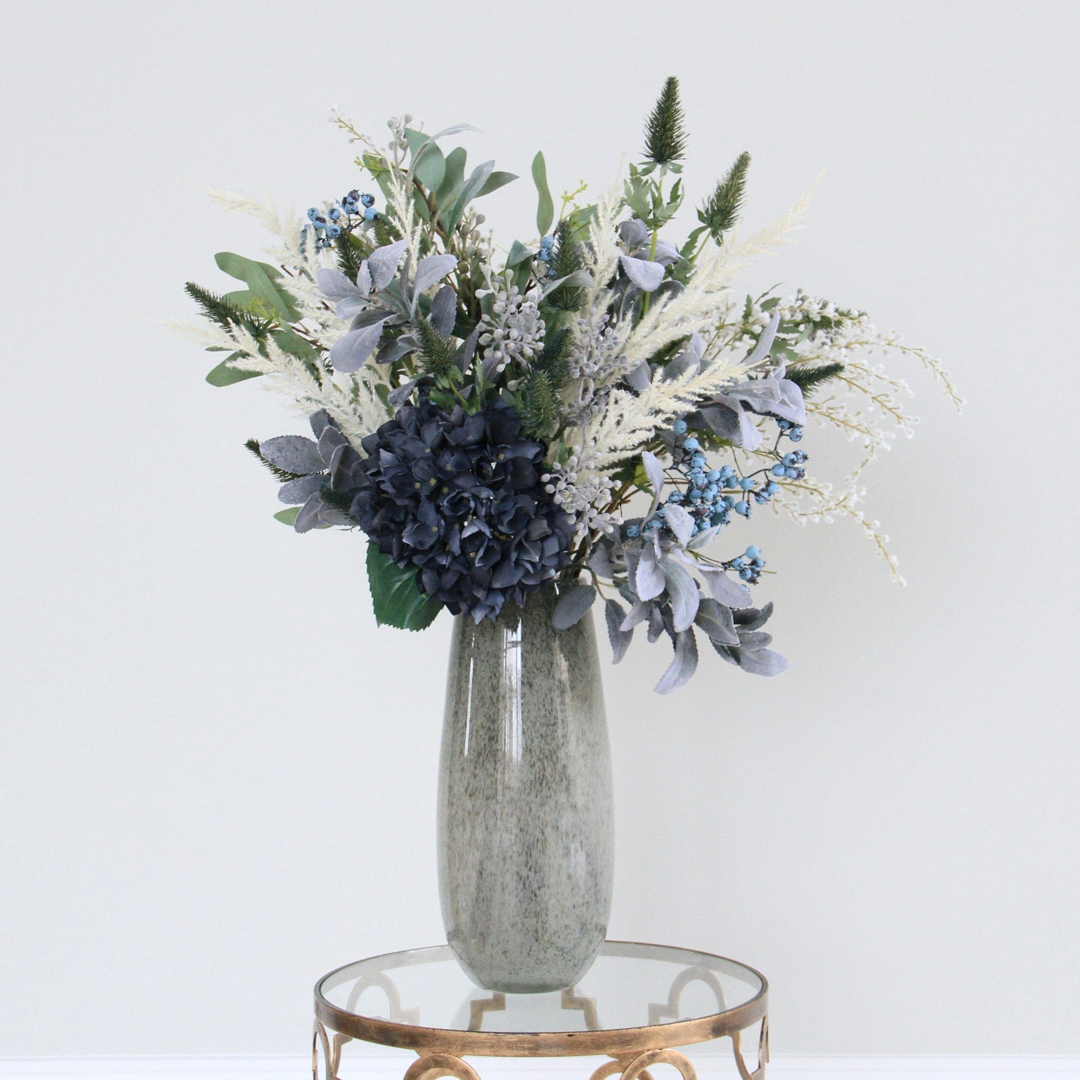 artificial christmas flowers and artificial christmas flower arrangement in silver white and blue, faux christmas flowers, christmas and artificial christmas bouquets to buy from Amaranthine Blooms UK